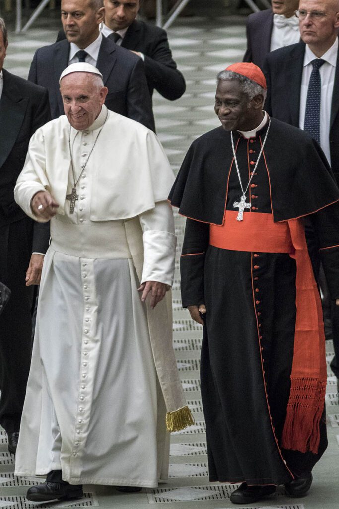 Pope Francis and Cardinal Peter Kodwo Appiah Turkson (R)